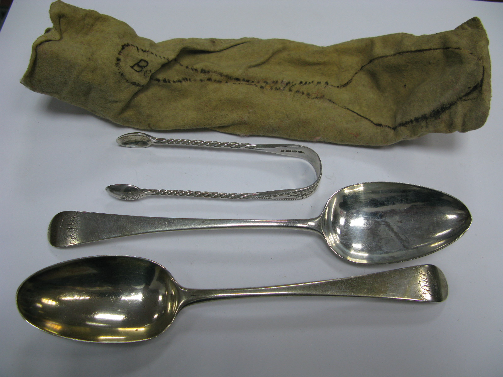 Two Hallmarked Silver Old English Pattern Table Spoons, initialled; together with a pair of