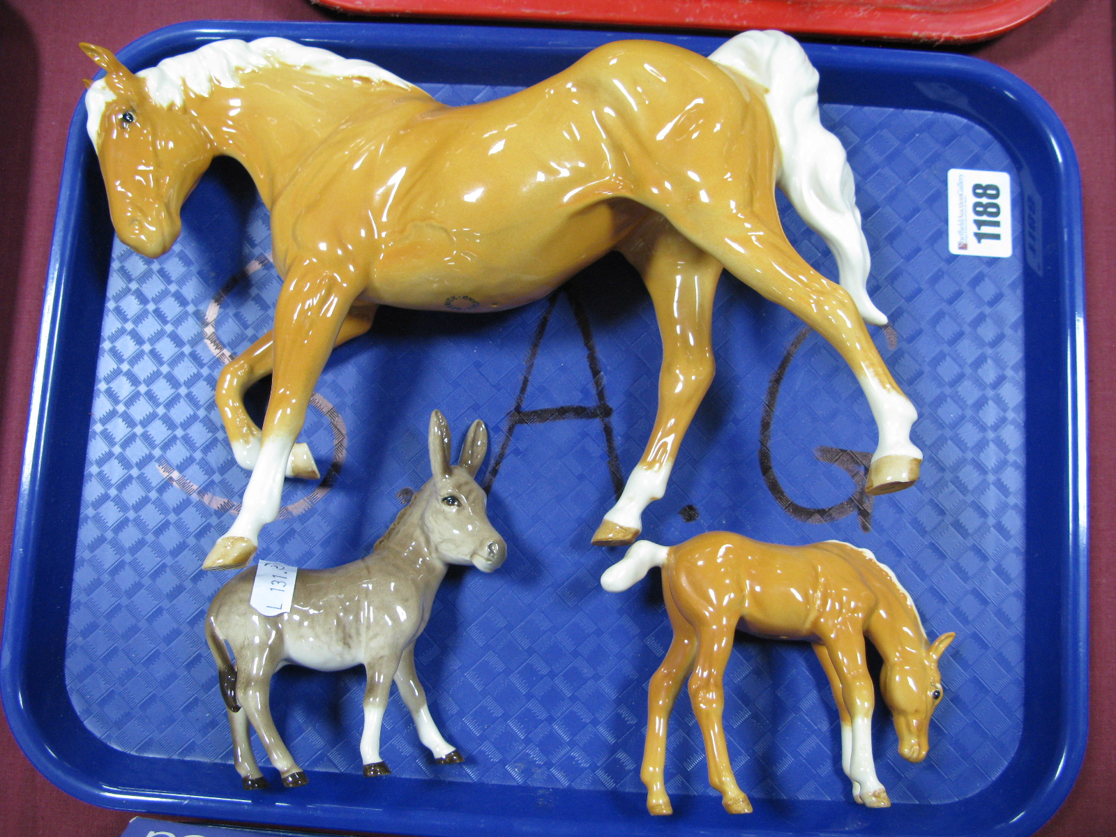 Beswick Palomino Arab Type Horse and Foal, plus a donkey. (3)