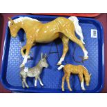 Beswick Palomino Arab Type Horse and Foal, plus a donkey. (3)