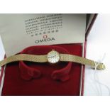 Omega; A 9ct Gold Cased Ladies Wristwatch, to integral textured tapering bracelet, in original box