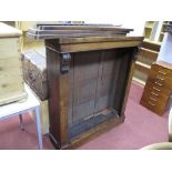 A XIX Century Mahogany Bookcase, with adjustable shelves, corner brackets, on a plinth base.