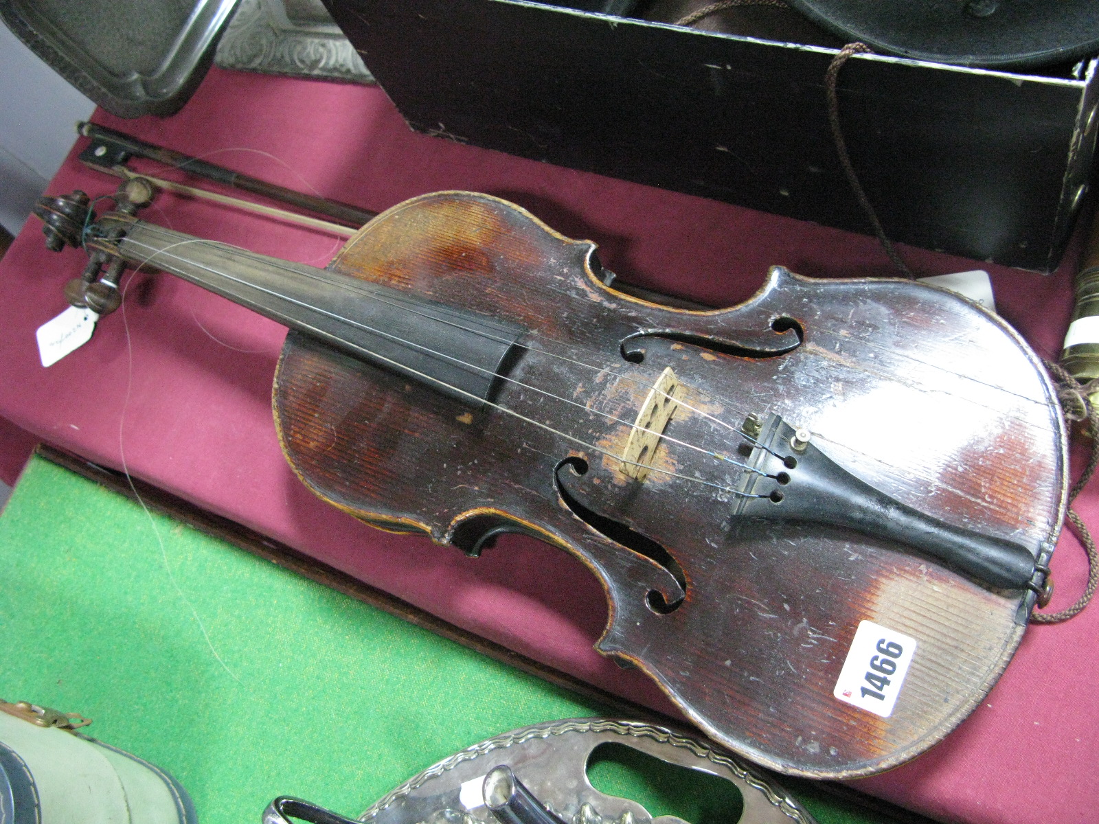 An Early XX Century Violin, with one piece back, length 36cm; together with a bow with mother of