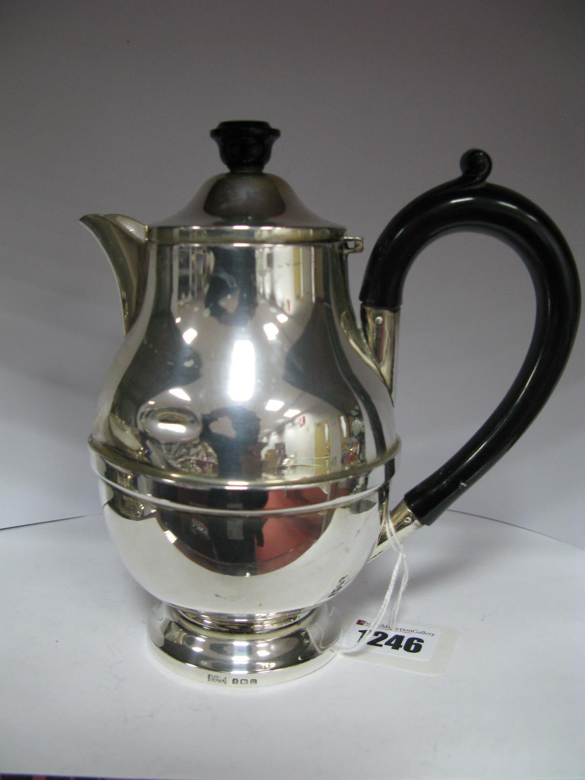 A Hallmarked Silver Hot Water Pot, ALD, Birmingham 1931, of plain design (dented).