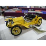 A Franlkin Mint 1915 Stutz Bearcat Roadstar in Yellow, boxed with paper work.