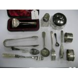 Hallmarked Silver Tongs, in a case, a hallmarked silver lidded jar, hallmarked silver napkin