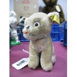 A 1960's Vintage Steiff Dog Mopsy, seated, in beige plush with swivel head, button and label to ear,