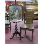 A XIX Century Mahogany Pole Screen, with a tapestry panel of a turned pedestal on cabriole legs,