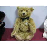 A Modern Jointed Teddy Bear by Steiff, with growler, button to ear, 56cm tall.