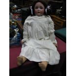 An Early XX Century German Bisque Headed Doll, with sleeping eyes, open mouth, makers mark