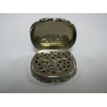 A Hallmarked Silver Vinaigrette, of shaped design allover leaf scroll engraved, inscribed "