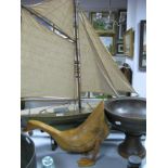 A Four Sail Model Boat on Stand; together with a wooden bowl and wooden duck.