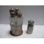 A Hallmarked Silver Openwork Stand, fitted with three shaped glass bottles; together with a