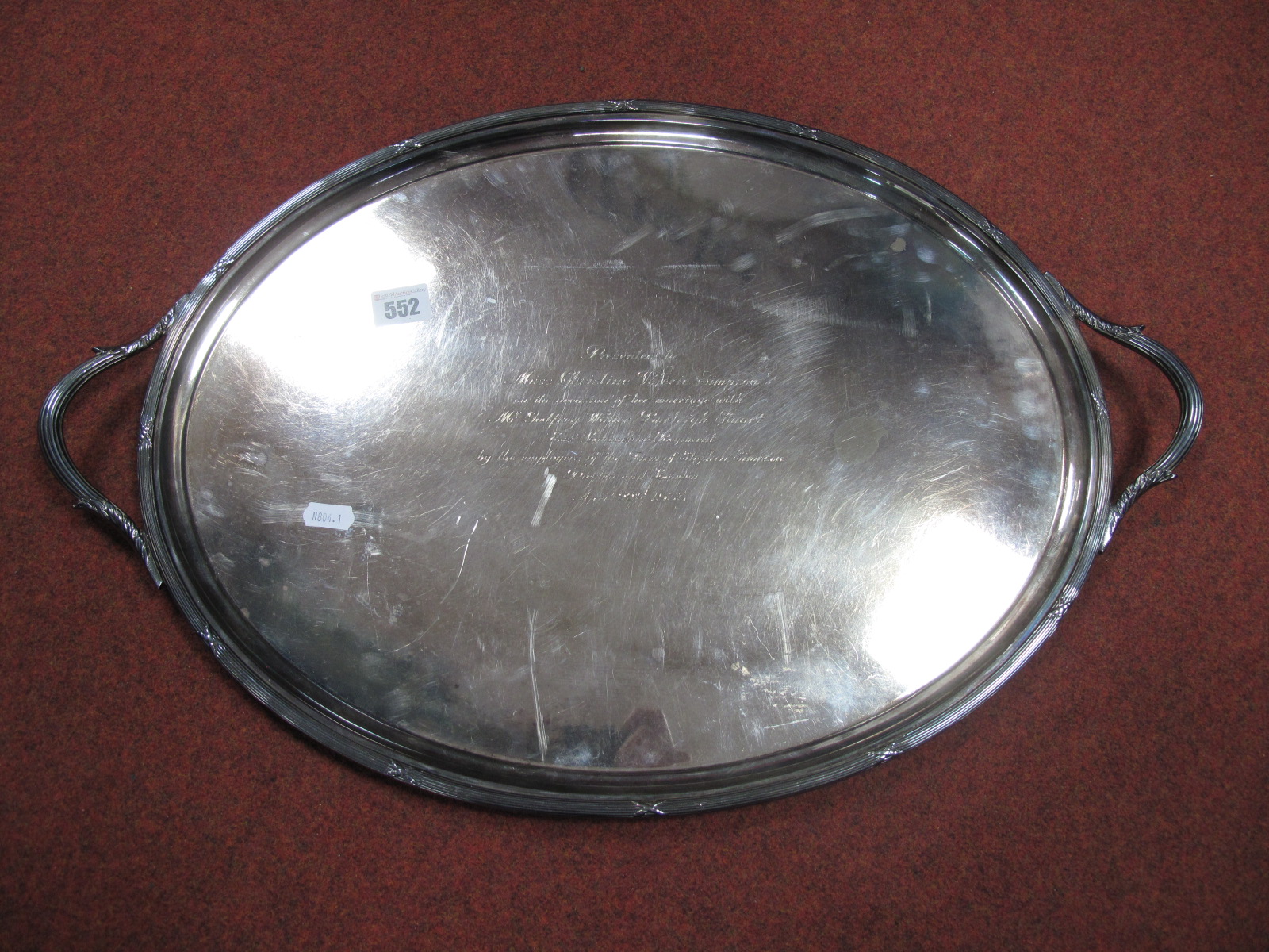 An Electroplated Oval Twin Handled Serving Tray, cast leaf and reeded handles, ribbon tie border,