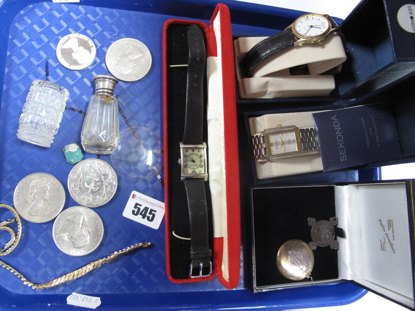 Wristwatches, commemorative coins, scent bottle etc:- One Tray