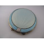 A Hallmarked Silver and Pale Blue Enamel Circular Ladies Compact (lacking puff).