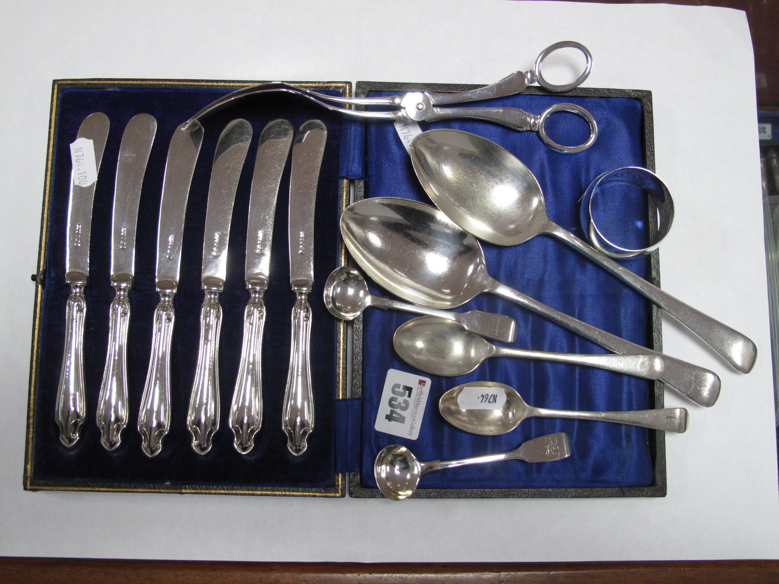 Three Hallmarked Silver Spoons, a hallmarked silver napkin ring, cased set of six tea knives,