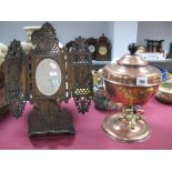 A Victorian Copper Tea/Hot Water Urn, and a Middle Eastern pierced and decorated mirror stand. (2)