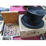 A Dunne and Co Black Silk Top Hat, (boxed) 15.5cm ear to ear; and a braille set. (2)