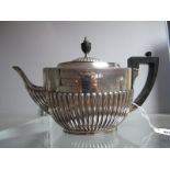 A Hallmarked Silver Tea Pot, Messrs Hutton, London 1900, of oval semi reeded form, bearing