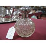 A Hallmarked Silver Topped Cut Glass Scent Bottle, with screw top.