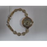A 9ct Gold Cased Ladies Wristwatch, on rolled gold openwork bracelet.