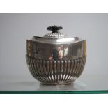 A Hallmarked Silver Lidded Sugar Bowl/Caddy, Messrs Hutton, London 1902 of oval semi reeded form.