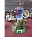 A Peggy Davies Figurine 'Clarice Cliff The Artisan', limited edition 493/500, 21cm high.