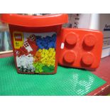 A Lego Board and a Tub of Loose Lego Pieces. (2)