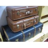 A Mid XX Century Travel Trunk, wooden ribbed and two tan travel cases. (3)