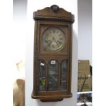 A 1920's Oak Regulator Wall Clock, with eight day movement.