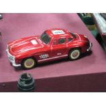 A Tinplate Model Car of a Mercedes.