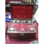 A XIX Century Rosewood Ladies Travelling Vanity Box, with mother or pearl eschucheon, glass