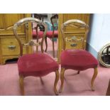 A Pair of XIX Century Walnut Salon Chairs, with a pierced central rail, upholsted seats, on cabriole