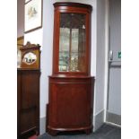 Yew Wood Double Corner Cupboard, with a glazed door, over a cupboard door, on bracket feet.