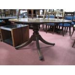 An Oval Topped Mahogany Pedestal Table, on four swept legs.