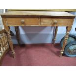 A Victorian Pine Washouse Table, with two drawers, on turned legs.