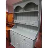 A Painted Pine Dresser, with four drawers to planked rack over two drawer and two cupboard doors,