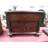 A XIX Century Style Miniature Chest of Drawers, with a moulded edge, three drawers, turned