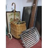 Woven Cane Mobile Shopping Basket, pair of brass andirons, fire grate and back plates, oak fender,