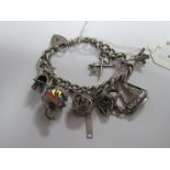 A Curb Link Charm Bracelet, suspending to heart shape padlock clasp, assorted charm pendants.