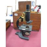 Spencer Buffalo U.S.A Microscope, in black lacquer and brass numbered 64024 with lenses in case.