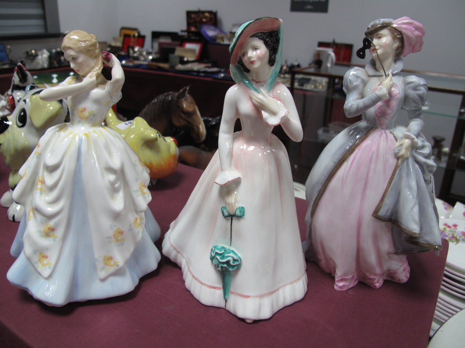 Royal Worcester Figurine 'Masquerade', Royal Doulton 'Laura' HN 2705 and 'Julia' HN 2706. (3)
