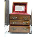 A Mid XIX Century Walnut Jewellery Box, with hinged lid and fitted interior over four small