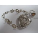 A Large Hallmarked Silver Heart Shaped Locket, of foliate design; together with stone set dress