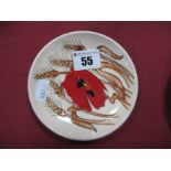A Moorcorft Pottery Circular Coaster, painted in the 'Harvest Poppy' pattern, designed by Emma