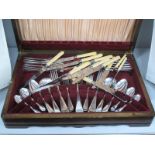 A Mahogany Canteen of Cutlery, including Wardonia knives, Hastings spoons & forks, approximately