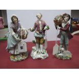 A Pair of Sitzendorf Flower Seller Figurines, each bearing blue stamp of S under crown, 18.5cm high,