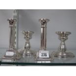 A Pair of Hallmarked Silver Candlesticks, (marks rubbed) 13cm high (bases weighted); together with a