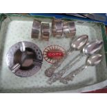Four Napkin Rings, stamped "SIAM Sterling", initialled "L"; an ashtray, allover decorated (7.3cm