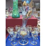 A Set of Six Venetian Stem Glasses and Matching Decanter, gilt highlighted flowerheads and scrolls a